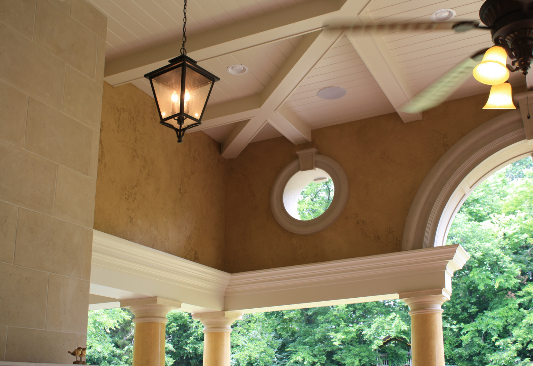 Custom designed loggia:  Venetian plaster columns with faux stone capitals and base and upper wall O’villa plaster finish.