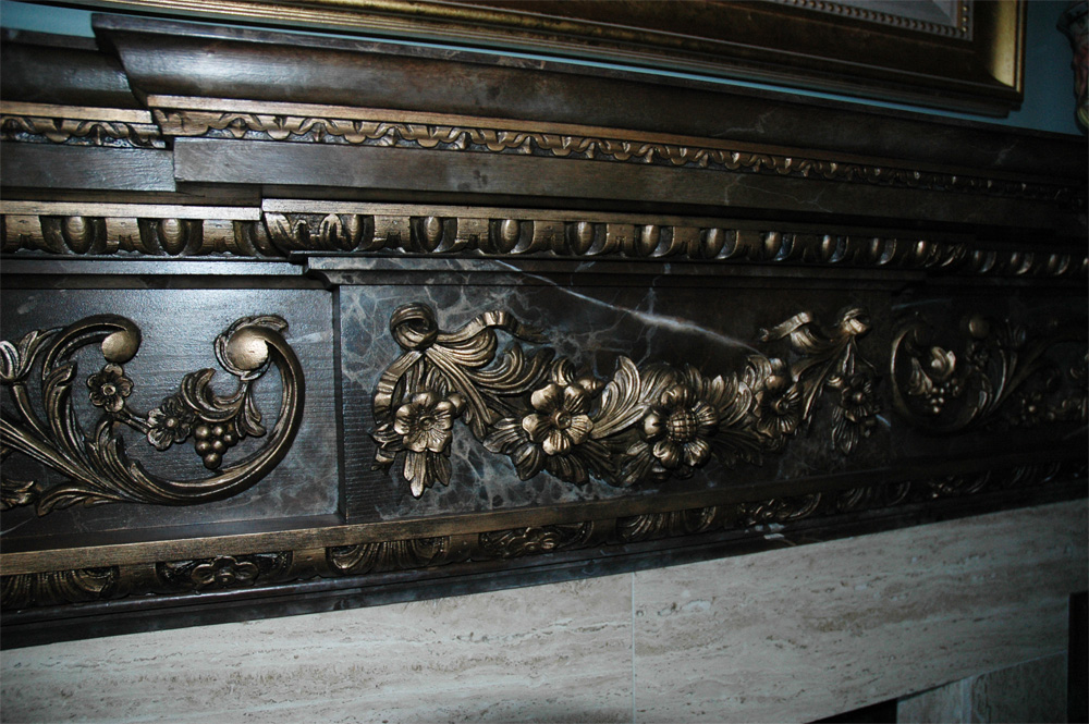 Faux marble and metal accents for this customer’s mantel.