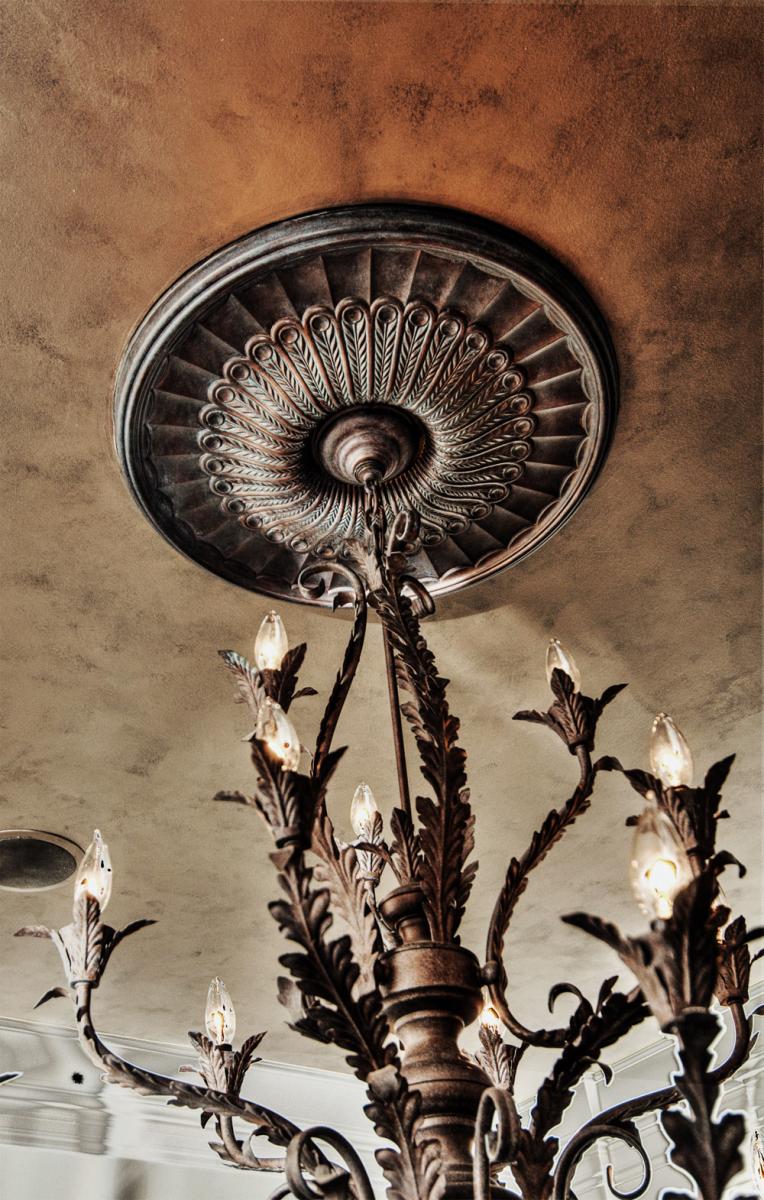 Faux bronze and iron medallion with silver /gold metallic and charcoal mica- power ceiling finish.