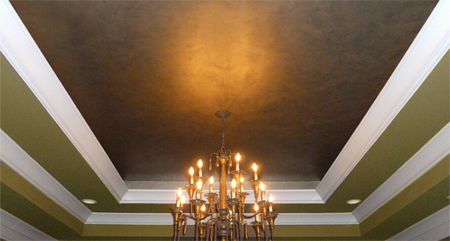 Faux bronze and silver metallic master bedroom tray ceiling.