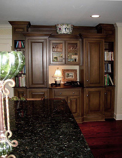Warm colored French glaze on side cabinets