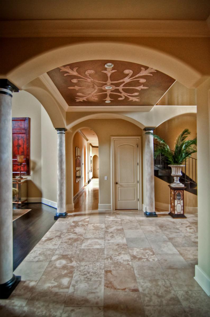 Faux stone columns and ceiling mural.