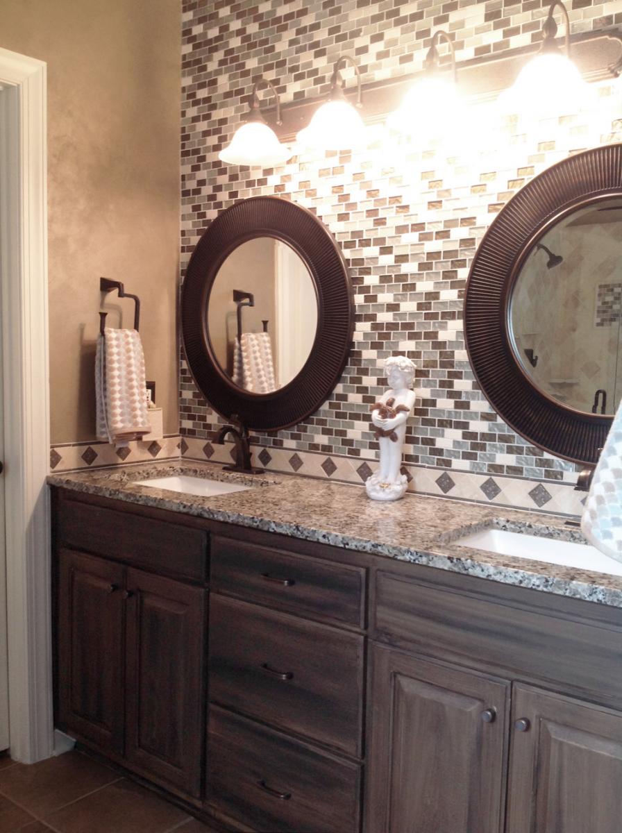 Shimmering Lusterstone walls and faux salvaged-walnut glazed vanity with blue ceiling