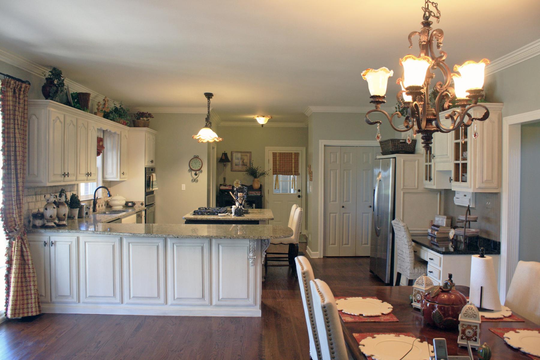 View this Mount Juliet customer’s kitchen cabinet transformation adding a warm modern Tuscan glaze look.