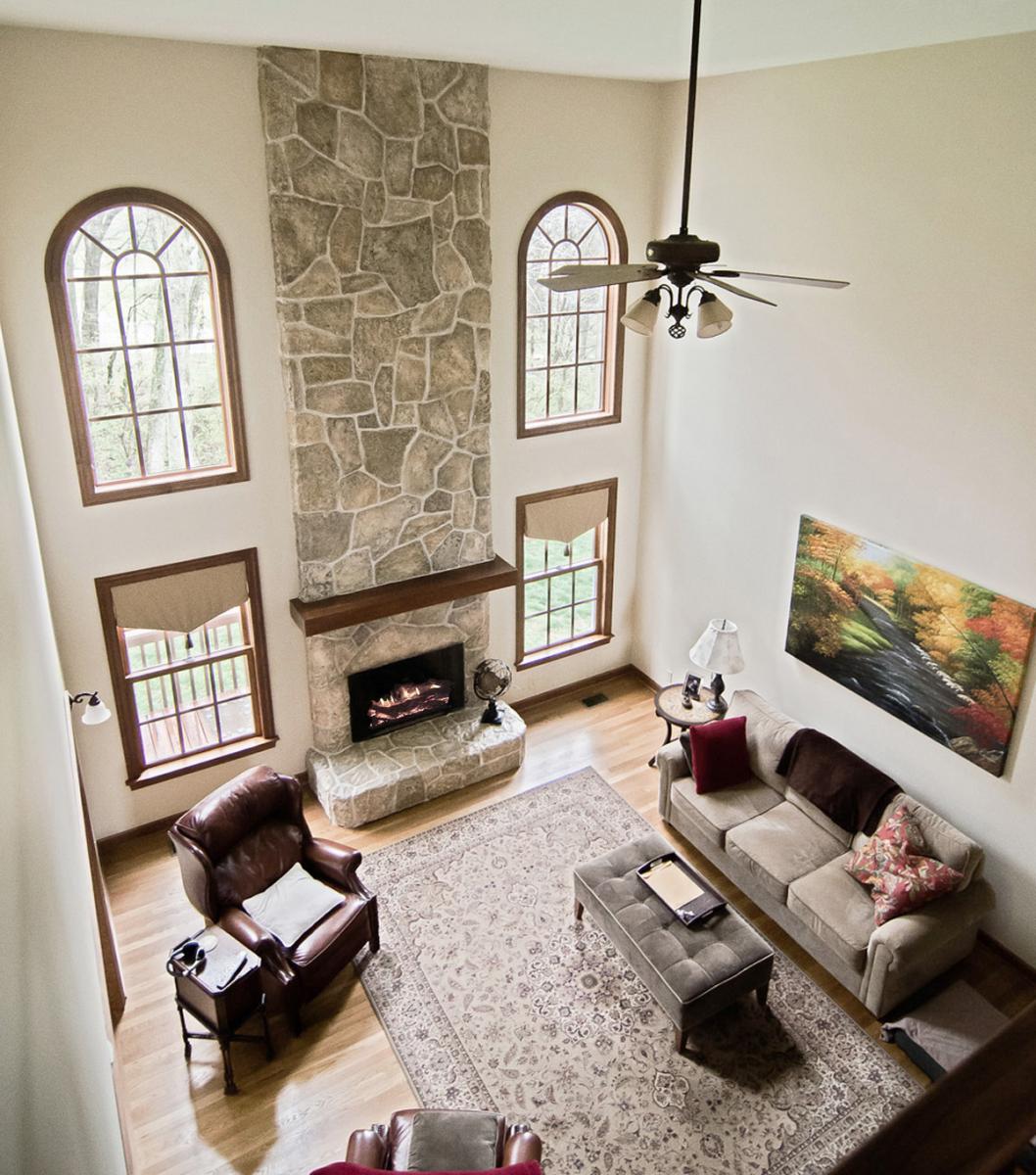 Faux plaster was used to create a complete new stone configuration. Then – custom colored glazes where applied to give this fireplace makeover that authentic look and feel.