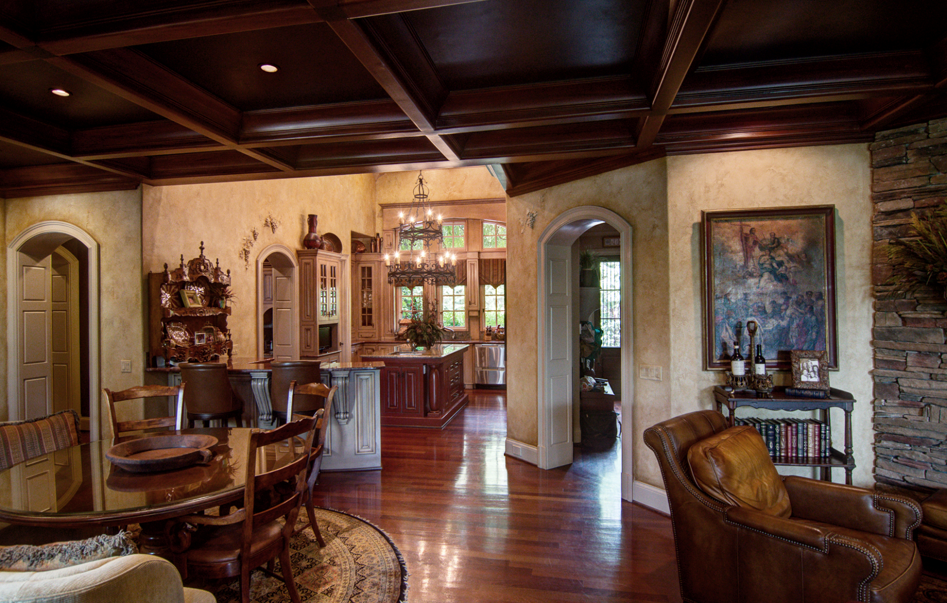 Wood grained ceiling, Tuscan plaster walls against warm glazed cabinetry.