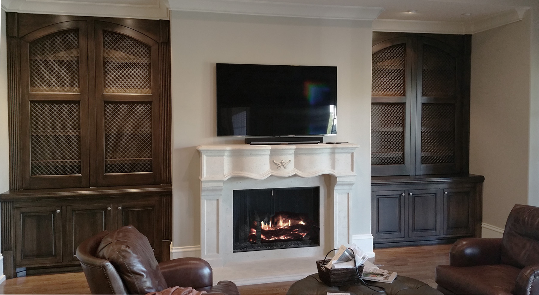 Wood grained built-in cabinets and painted feature wall and glazed hearth.