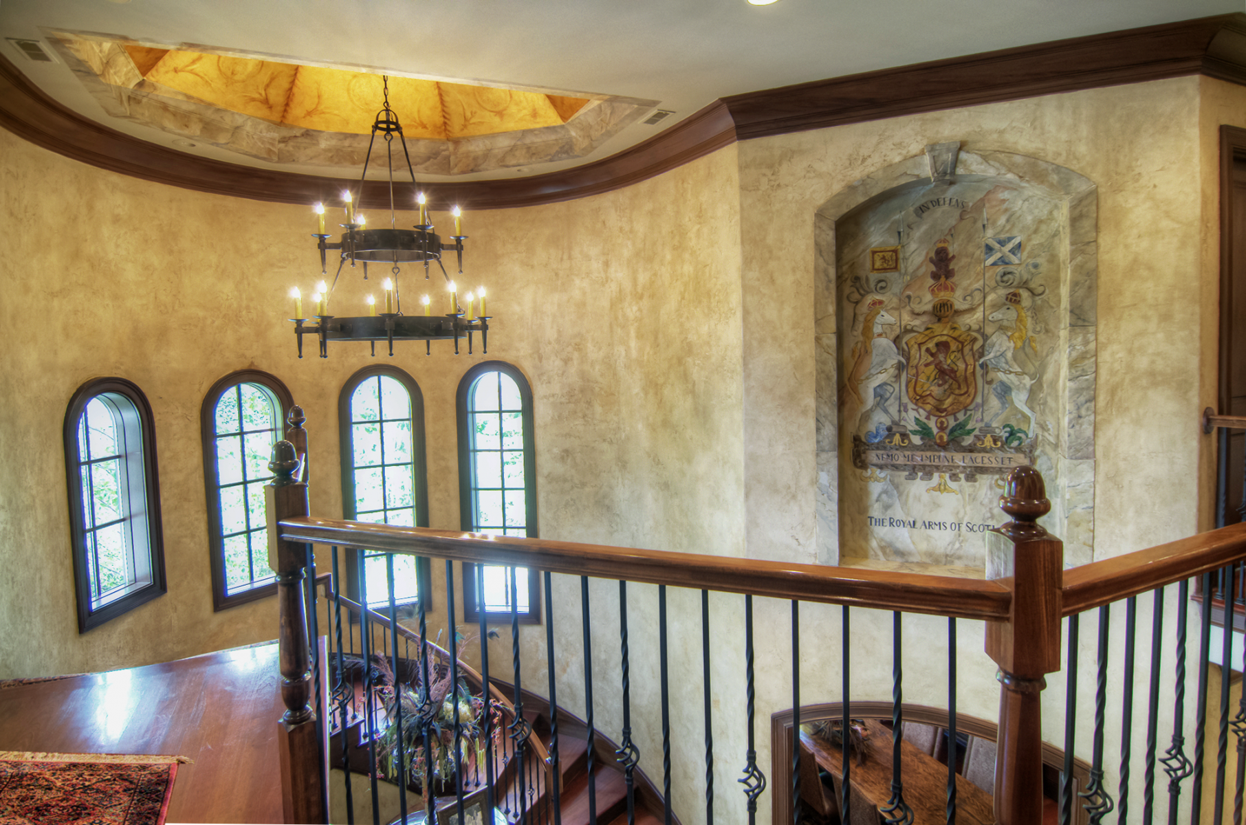 European plaster walls with wood glazed trim custom ceiling mural and marble crest.