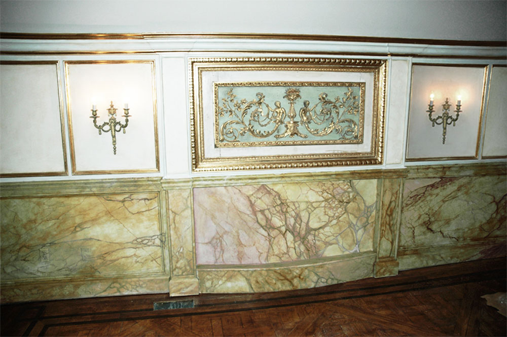 Faux marble wainscot, faux wood grained floor inlay and gold leaf mill-work trim from Andrew Bruckman.