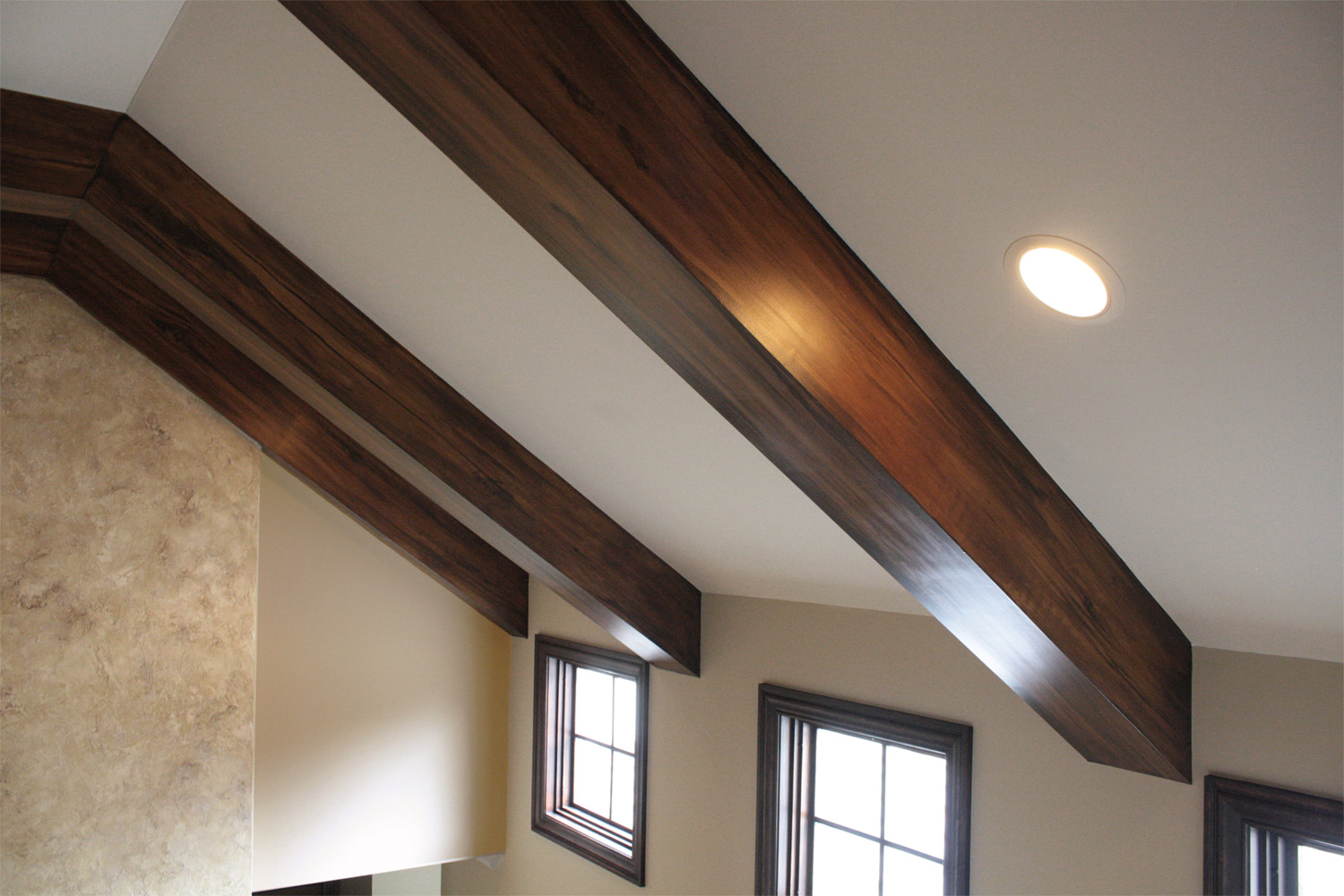 Faux wood beams in this Brentwood customers great room ceiling.