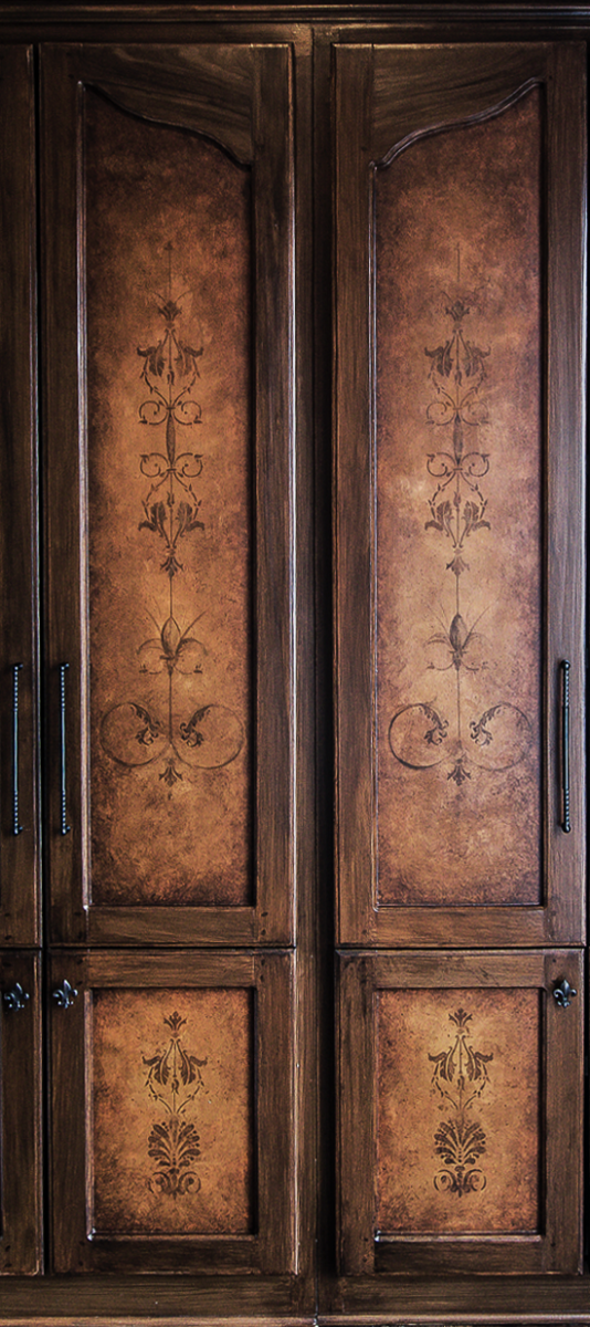 Custom hand painted built-in wood graining and mural door faces.