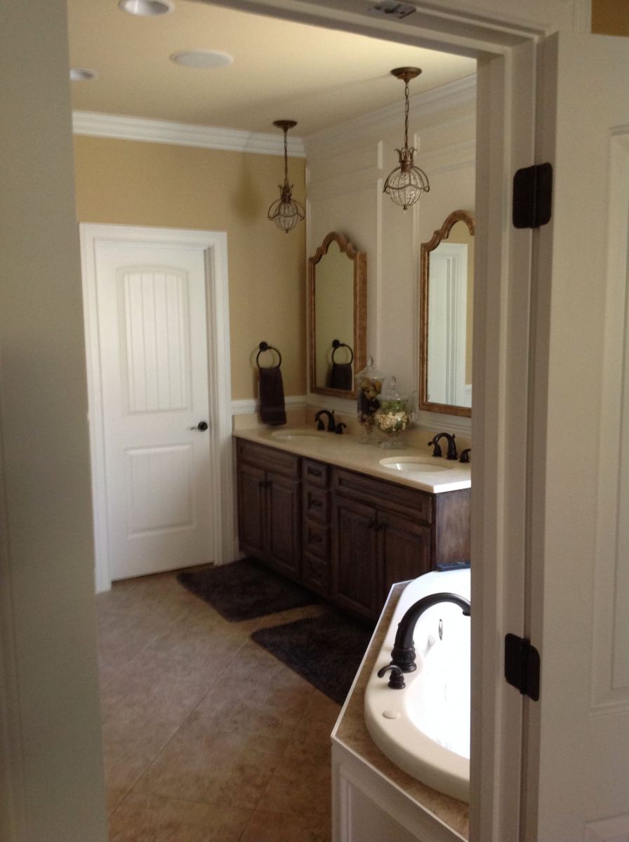 Custom wall color and rustic natural glaze applied to this master bath vanity