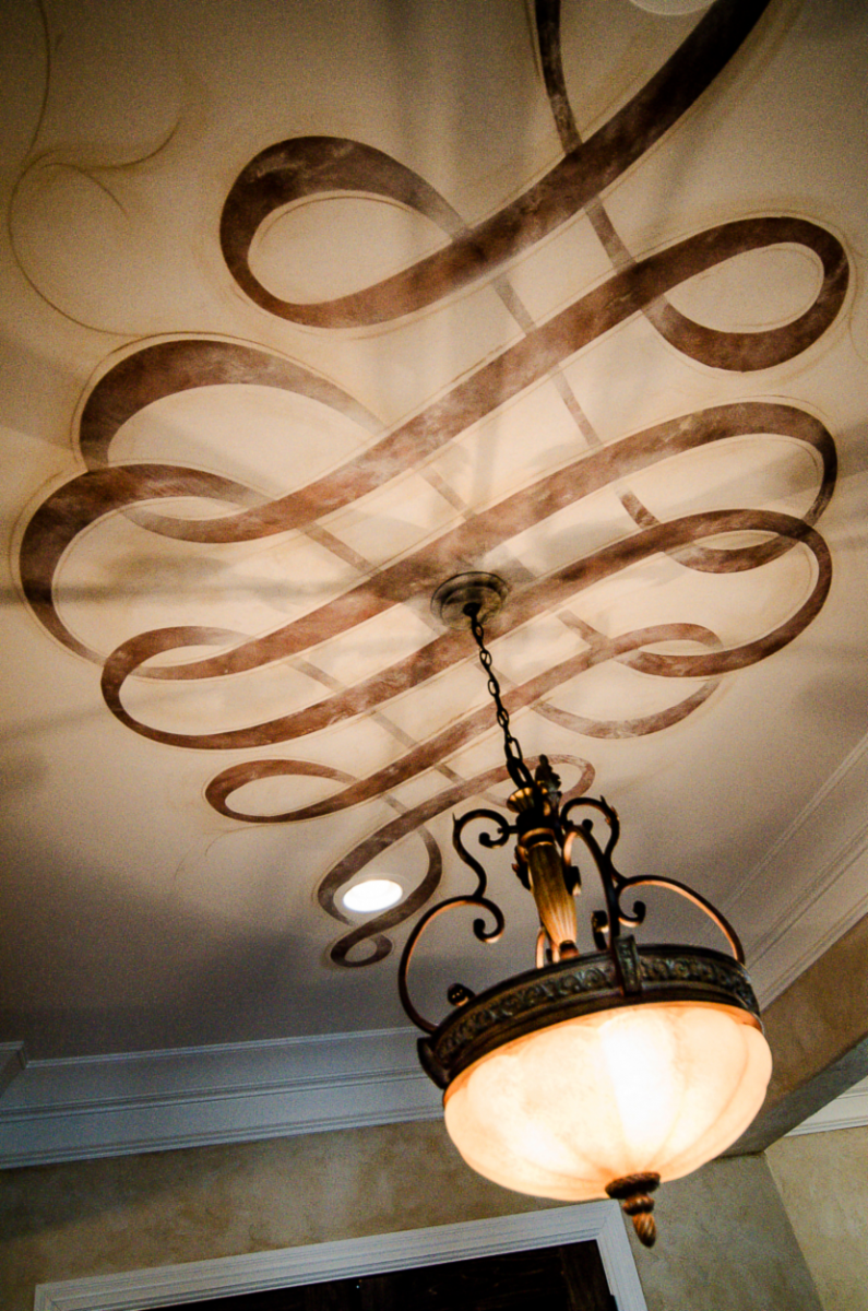 Hand enhanced Modello ceiling scroll designs.