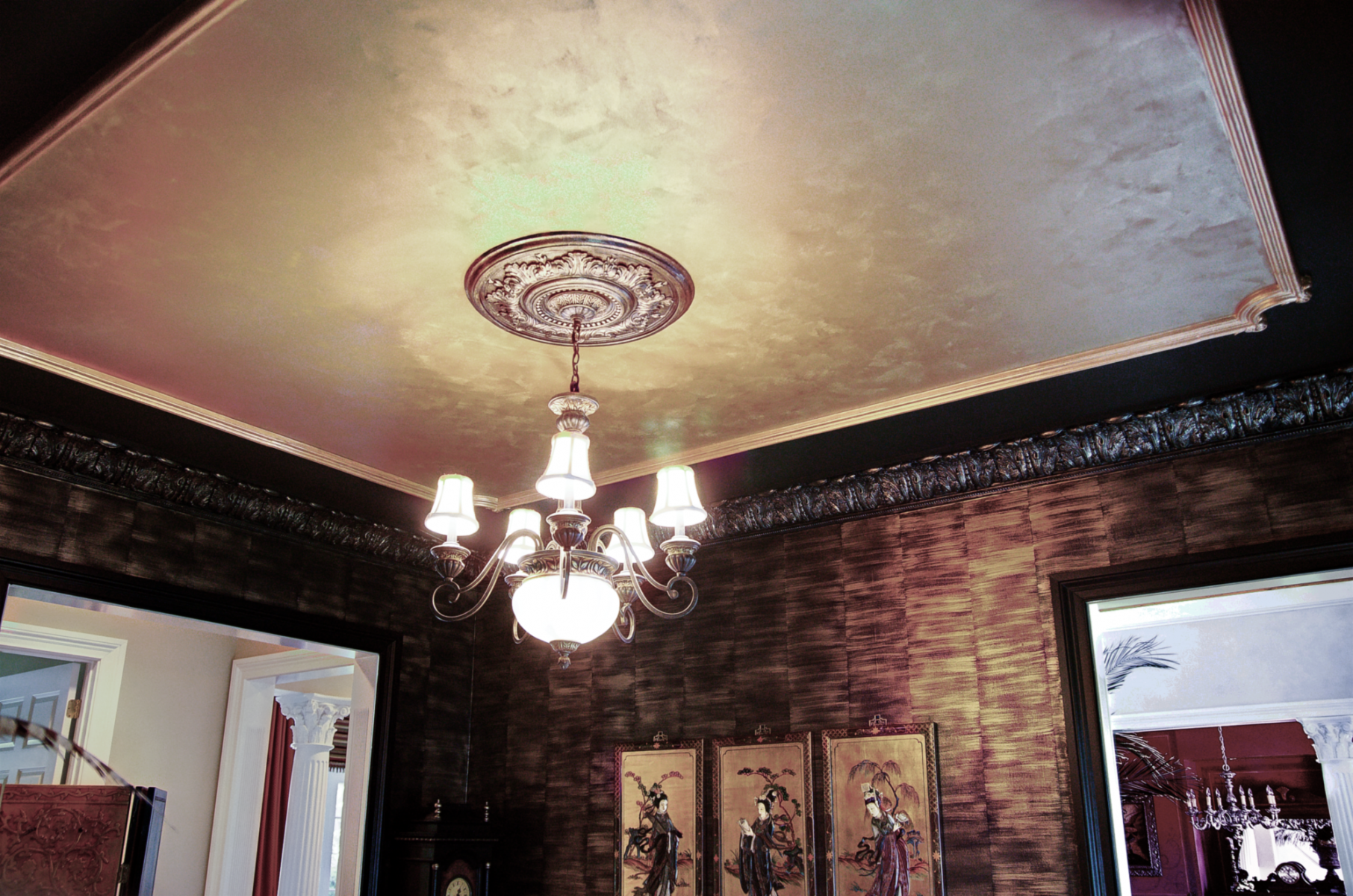 Custom ceiling design of faux metallic gold.